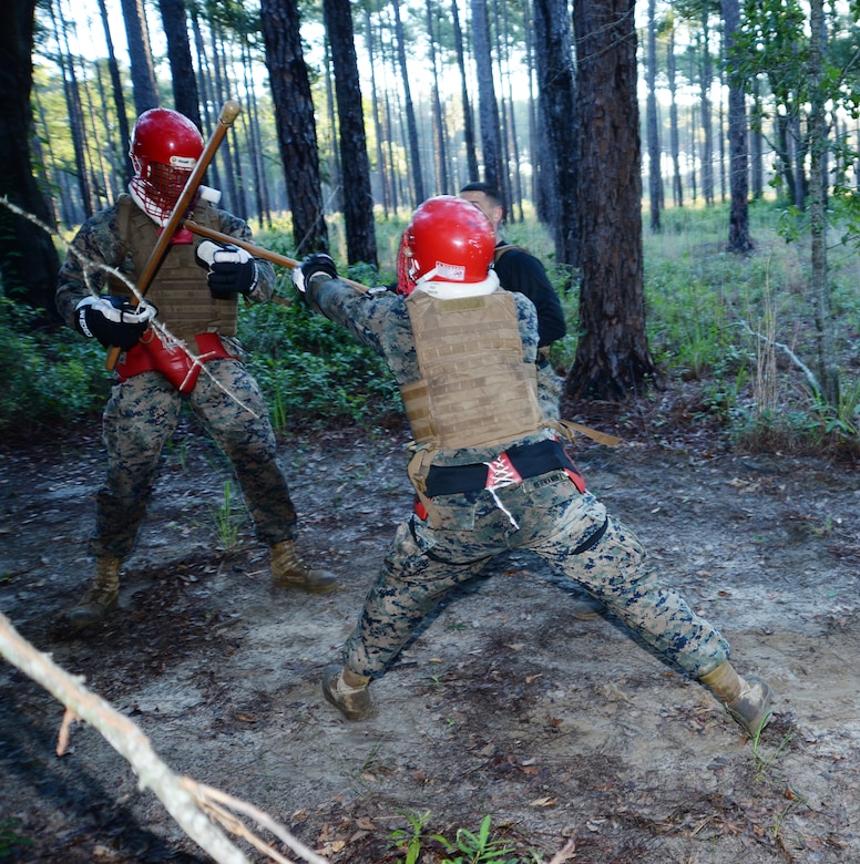 Sgt. Salvador Hernandez, right, martial arts instructor student, executes a straight thrust and defeats Sgt. Frederick Graham, martial arts instructor student, in a weapons-free sparring match during a Martial Arts Instructor Course aboard Marine Corps Logistics Base Albany, May 25.