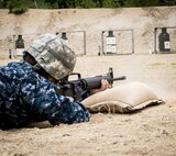 Ensign David Segala, an Engineer Duty Officer from New London, Connecticut opens fire on a zero range at Fort Devens, Massachusetts. Navy junior officers participated in a joint training environment with Army drill sergeants to train up for future deployments June 3, 2017.