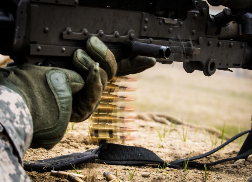 A drill sergeant from the 1st Battalion, 304th Infantry Regiment fires an M240B at a target on a crew-serve weapons range at Fort Devens, MA June 3, 2017. Drill sergeants participated in joint training with junior Navy officers to train them for future deployments with Army engineer units.