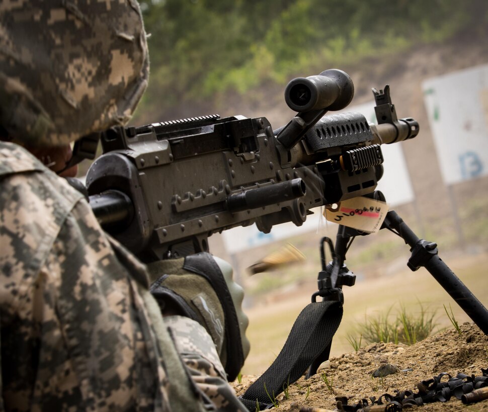 A drill sergeant from the 1st Battalion, 304th Infantry Regiment engages a target during M240B familiarization training at Fort Devens, MA. Soldiers and Navy junior officers participated in a joint training exercise to enhance skills essential to unit readiness June 3, 2017.