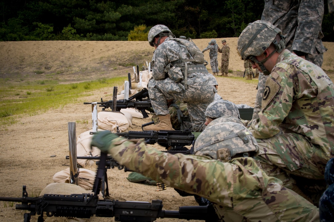 Drill sergeants from the 1st Battalion, 304th Infantry Regiment load crew-served and automatic weapons on a familiarization range at Fort Devens, MA June 3, 2017.