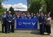 Graduates of the Community College of the Air Force stand with distinguished guests following a commencement ceremony, June 2, 2017 at the McChord Theater at Joint Base Lewis-McChord, Wash. The CCAF provides Airmen an opportunity to leverage their military training toward furthering their education. (U.S. Air Force photo/Staff Sgt. Whitney Taylor)