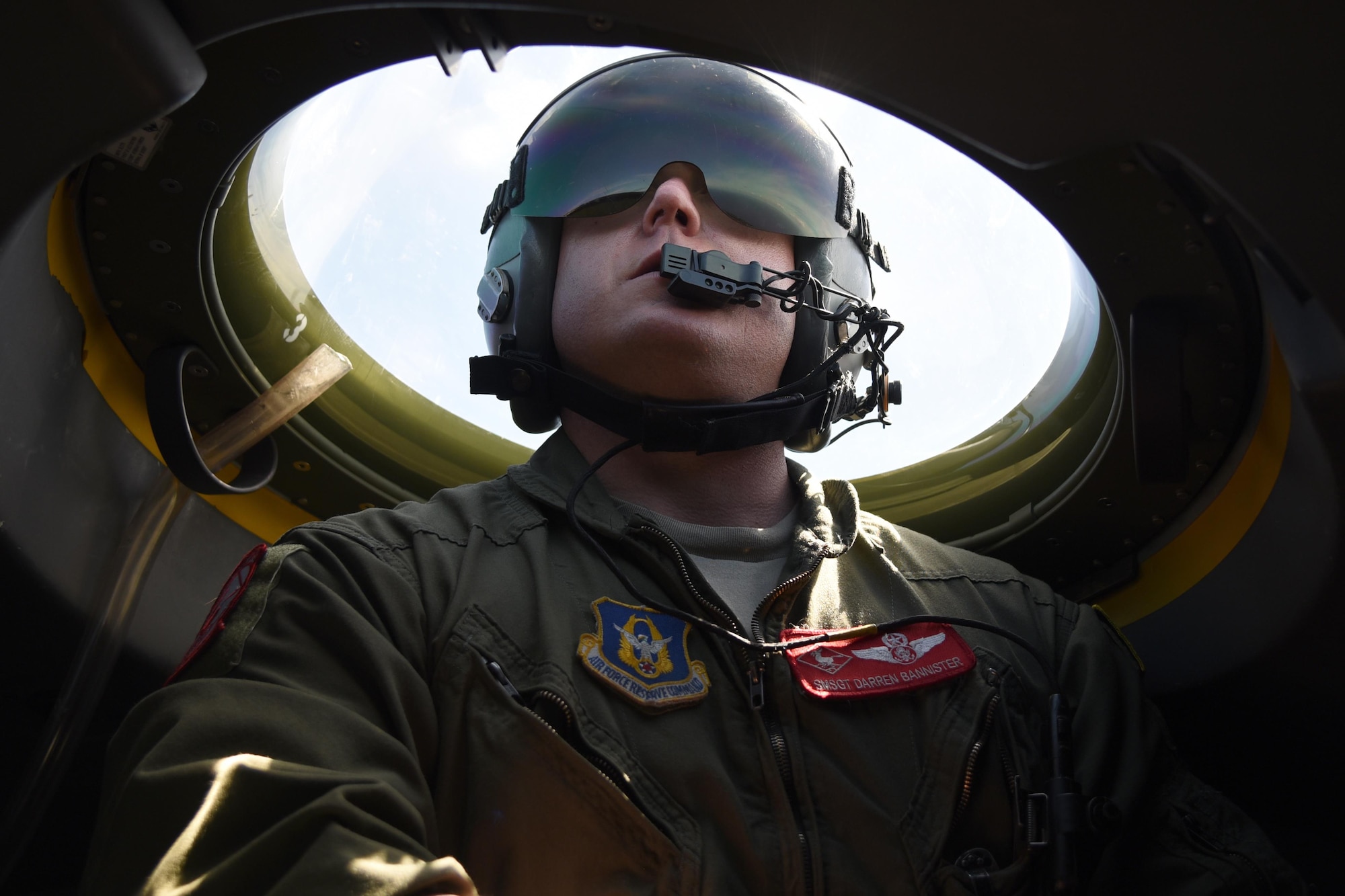 Senior Master Sgt. Darren Bannister, loadmaster with the 815th Airlift Squadron looks out of the bubble on the flight deck while taking part in a paratroop drop over Normandy, France. This event commemorates the 73rd anniversary of D-Day, the largest multi-national amphibious landing and operational military airdrop in history, and highlights the U.S.' steadfast commitment to European allies and partners. Overall, approximately 400 U.S. service members from units in Europe and the U.S. are participating in ceremonial D-Day events from May 31 to June 7, 2017(U.S. Air Force photo by Staff Sgt. Nicholas Monteleone)
