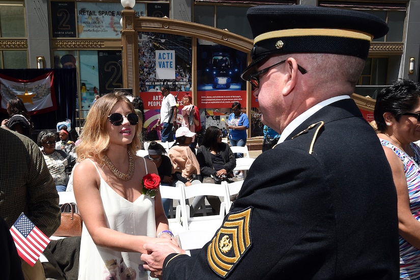 Command Sgt. Maj. Vernon Perry III, Command Sergeant Major, 85th Support Command shakes the hand of Shelby Iubel, wife of Pfc. Tyler Iubelt, thanking her for the sacrifice her husband made. Iubelt, who served with the First Cavalry Sustainment Brigade, was killed in Afghanistan on November 12, 2016. S. Iubelt said she was honored to see so many people reach out to show her and her mother-in-law so much love and support. Iubelt and her mother-in-law were recognized for their sacrifice during the Wreath Laying ceremony at the Richard J. Daley Plaza on May 27, 2017 in Chicago.
(U.S. Army photo by Sgt. Aaron Berogan/Released)