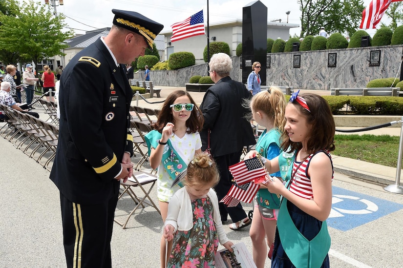 U.S. Army Reserve Brig. Gen. Frederick R. Maiocco Jr., (left) Commanding General, 85th Support Command, thanks girl scouts from Troupe 23121 for helping seat the ceremony attendees, pass out flags, and hand out programs in Norridge, Illinois during a Memorial Day commemoration on May 28, 2017. Maiocco was the keynote speaker at the village’s Memorial Day ceremony. Maiocco spoke about the importance of not only remembering those who had died but to support our Gold Star Families who had lost a loved one in defense of the nation.
(U.S. Army photo by Sgt. Aaron Berogan/Released)