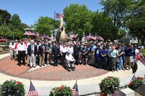 The veterans of Arlington Heights pause for a photo with U.S. Army Reserve Brig. Gen. Frederick R. Maiocco Jr., (center right) Commanding General, 85th Support Command, and Command Sgt. Maj. Vernon Perry III (center left) Command Sergeant Major, 85th Support Command, in front of the Eternal Flame at Memorial Park in Arlington Heights, Illinois, May 29, 2017. The group gathered for a photo after the conclusion of the Memorial Day commemoration. 
(U.S. Army photo by Sgt. Aaron Berogan/Released)