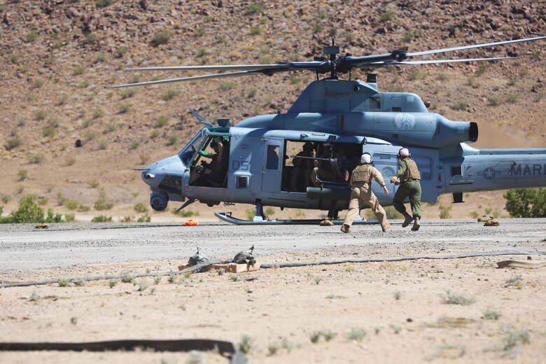 Marines with Marine Wing Support Squadron (MWSS) 373 prepare to refuel a UH-1Y Huey at an field aircraft refuel point (FARP) during Integrated Training Exercise (ITX) 3-17 on Marine Corps Air Ground Combat Center Twentynine Palms, Calif., May 17. ITX is a combined-arms training exercise enabling Marines across 3rd Marine Aircraft Wing to operate as an aviation combat element integrated with ground and logistics combat elements as a Marine air-ground task force. More than 650 Marines and 27 aircraft with 3rd MAW are supporting ITX 3-17. (U.S. Marine Corps photo by Sgt. David Bickel/Released)