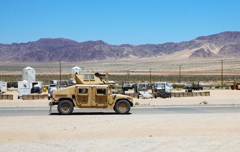 Marines with Marine Wing Support Squadron (MWSS) 373 return from their guard post and prepare to conduct an area damage assessment as part of the base recovery after attack training (BRAAT) evolution during Integrated Training Exercise (ITX) 3-17 at Marine Corps Air Ground Combat Center Twentynine Palms, Calif., May 23. ITX is a combined-arms exercise enabling Marines across 3rd Marine Aircraft Wing to operate as an aviation combat element integrated with ground and logistics combat elements as a Marine air-ground task force. More than 650 Marines and 27 aircraft with 3rd MAW are supporting ITX 3-17. (U.S. Marine Corps photo by Sgt. David Bickel/Released)