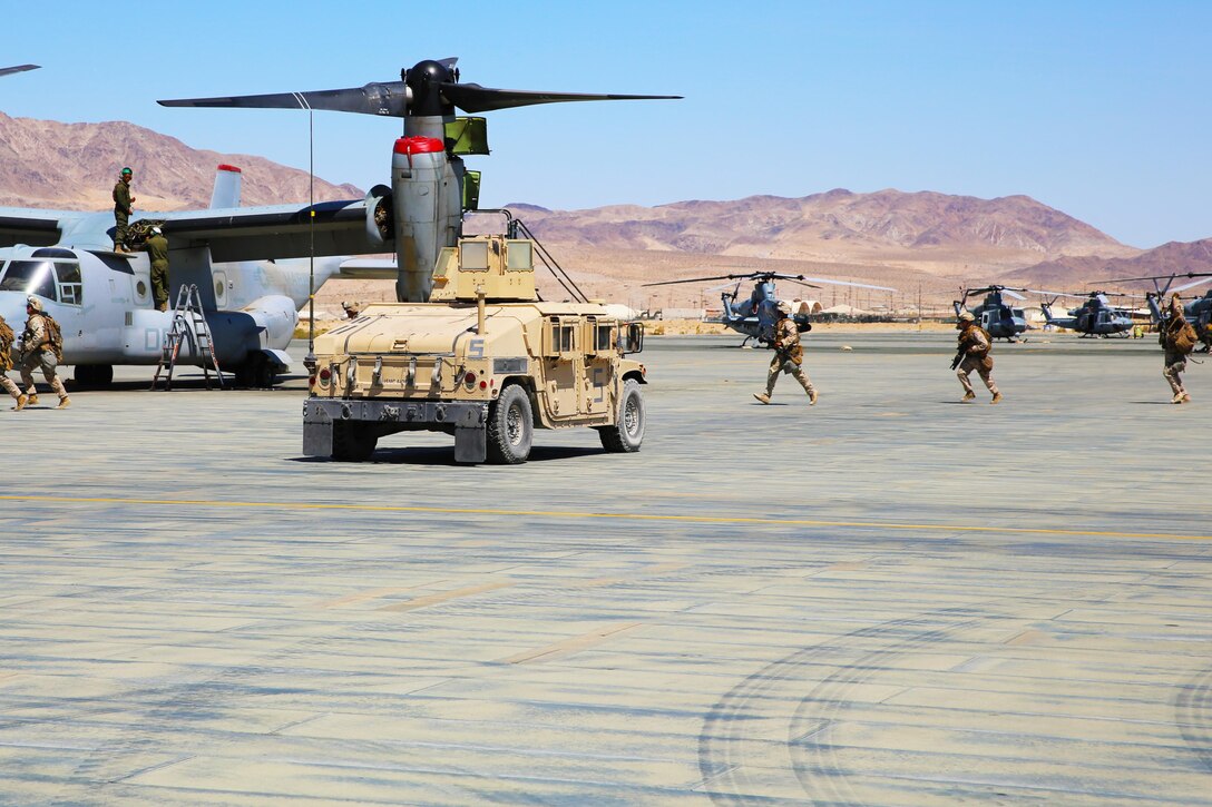 Marines with Marine Wing Support Squadron (MWSS) 373 return from their guard post and prepare to conduct an area damage assessment as part of the base recovery after attack training (BRAAT) evolution during Integrated Training Exercise (ITX) 3-17 at Marine Corps Air Ground Combat Center Twentynine Palms, Calif., May 23. ITX is a combined-arms exercise enabling Marines across 3rd Marine Aircraft Wing to operate as an aviation combat element integrated with ground and logistics combat elements as a Marine air-ground task force. More than 650 Marines and 27 aircraft with 3rd MAW are supporting ITX 3-17. (U.S. Marine Corps photo by Sgt. David Bickel/Released)