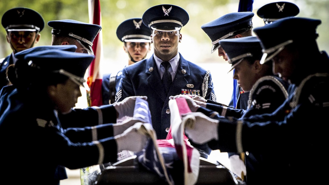 Air Force Staff Sgt. Gregory Barker presides over the flag-folding portion of the Eglin Honor Guard graduation ceremony performance at Eglin Air Force Base, Fla., June 1, 2017. Air Force photo by Samuel King Jr.