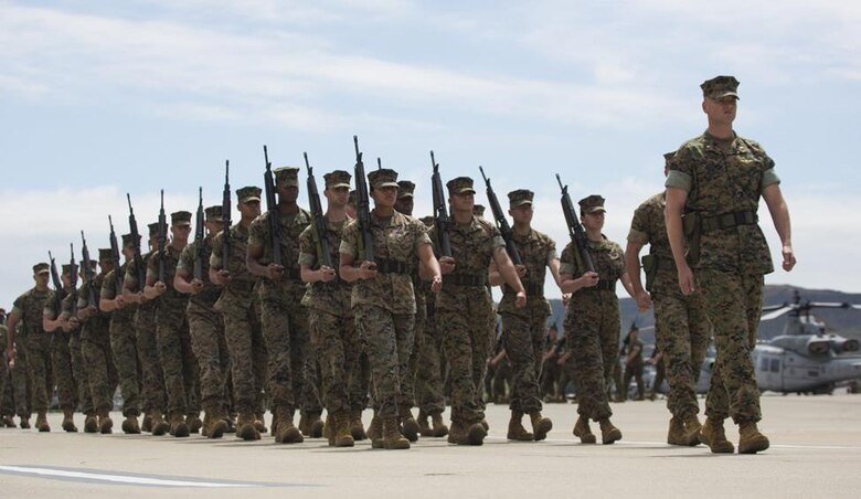 Marines with Marine Aircraft Group (MAG) 39 march down the flightline at Marine Corps Air Station Camp Pendleton, Calif., during the MAG-39 change of command ceremony, May 25. During the ceremony, command of MAG-39 changed hands from Col. Michael Borgschulte to Col. Matthew Mowery. (U.S. Marine Corps photo by Lance Cpl. Liah Smuin/Released)