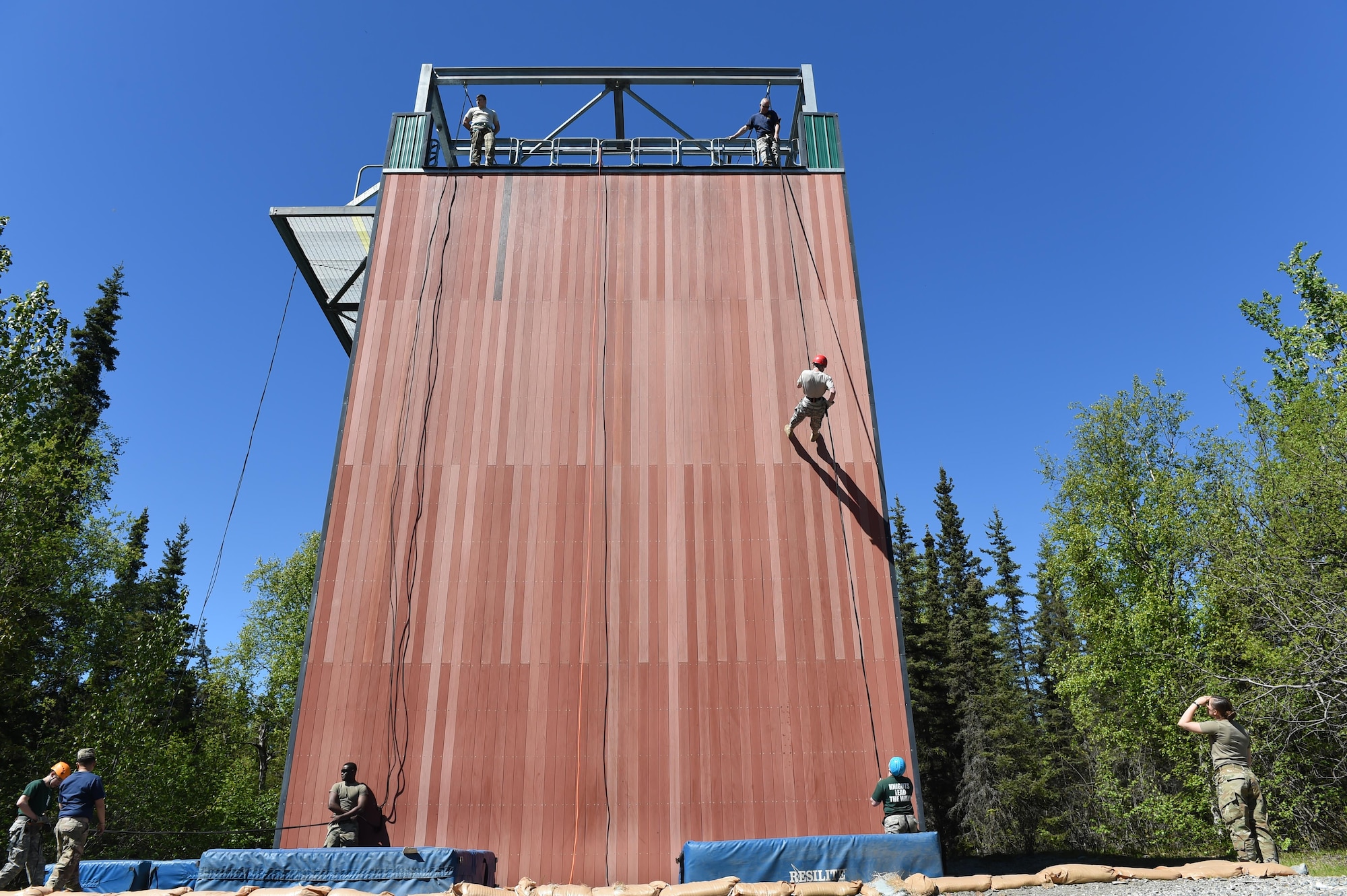 East, Bartlett, and Colony high school students descend from the jump tower near Joint Base Elmendorf-Richardson’s Camp Carroll during the 2017 Summer Leadership Camp May 30, 2017. More than 200 cadets from seven area high schools are scheduled to participate in the camp hosted from May 30 to June 9. 