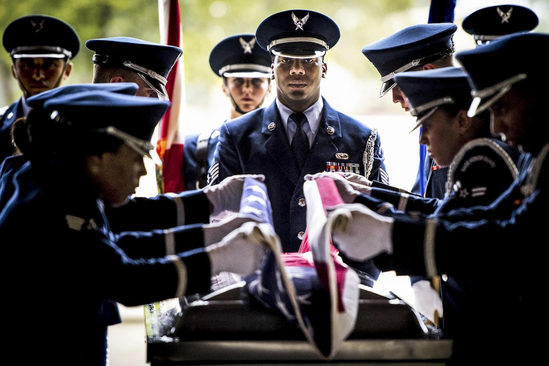 Air Force Staff Sgt. Gregory Barker presides over the flag-folding portion of the Eglin Honor Guard graduation ceremony performance at Eglin Air Force Base, Fla., June 1, 2017. Air Force photo by Samuel King Jr.