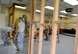 U.S. Air Force Airmen from the 18th Civil Engineer Squadron move part of a wall frame as part of a workspace expansion project at the 961st Airborne Air Control Squadron May 17, 2017, at Kadena Air Base, Japan. The 18th CES maintains over 23 million square feet of facilities on Kadena. (U.S. Air Force photo by Senior Airman Lynette M. Rolen)