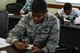 U.S. Air Force Airman 1st Class Fredrick Williams, 18th Component Maintenance Squadron electrical and environment systems apprentice, writes down a response to a question posed during Green Dot Key Influencer Training May 24, 2017 at Kadena Air Base, Japan. The Key Influencer Training provided participants with opportunities to use critical thinking to address scenarios of power-based interpersonal violence. (U.S. Air Force photo by Senior Airman Lynette M. Rolen)