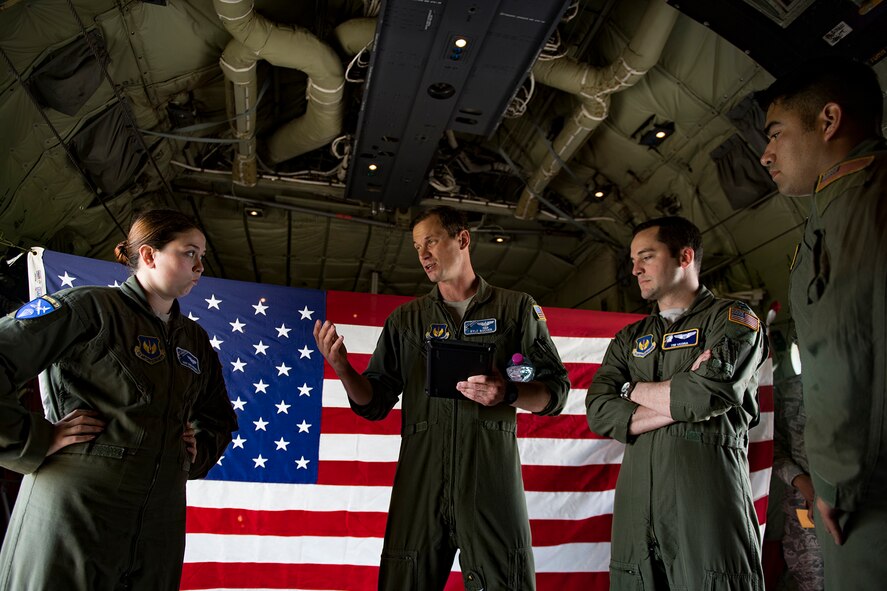 U.S. Air Force Maj. Kyle Bucher, 37th Airlift Squadron pilot, briefs his team before taking off in a C-130J Super Hercules assigned to the 37th AS at Ramstein Air Base, Germany, at Cherbourg-Maupertus Airport, France, June 2, 2017. The 37th AS performed flyovers over Normandy as part of the D-Day events. The events commemorate the 73rd anniversary of D-Day, the largest multinational amphibious landing and operational military airdrop in history, and highlights the U.S.' steadfast commitment to European allies and partners. Overall, approximately 400 U.S. service members from units in Europe and the U.S. are participating in ceremonial D-Day 73 events from May 31-June 7, 2017. (U.S. Air Force photo by Senior Airman Devin Boyer)