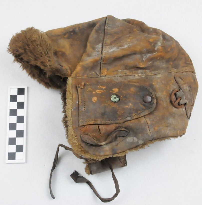 Helmet, aviator's, of sewn brown leather with shearling lining, ear flaps, chin straps, and metal snaps and buckles with interior maker's tag: "A. O. Spalding & Bros. Spalding Trademark Made in USA Reg US Pat. Off", part of uniform worn used by Coast Guard Warrant Officer Cadmus Daniel Griffin, WWI.
Heritage Asset Collection, 2014.024.006