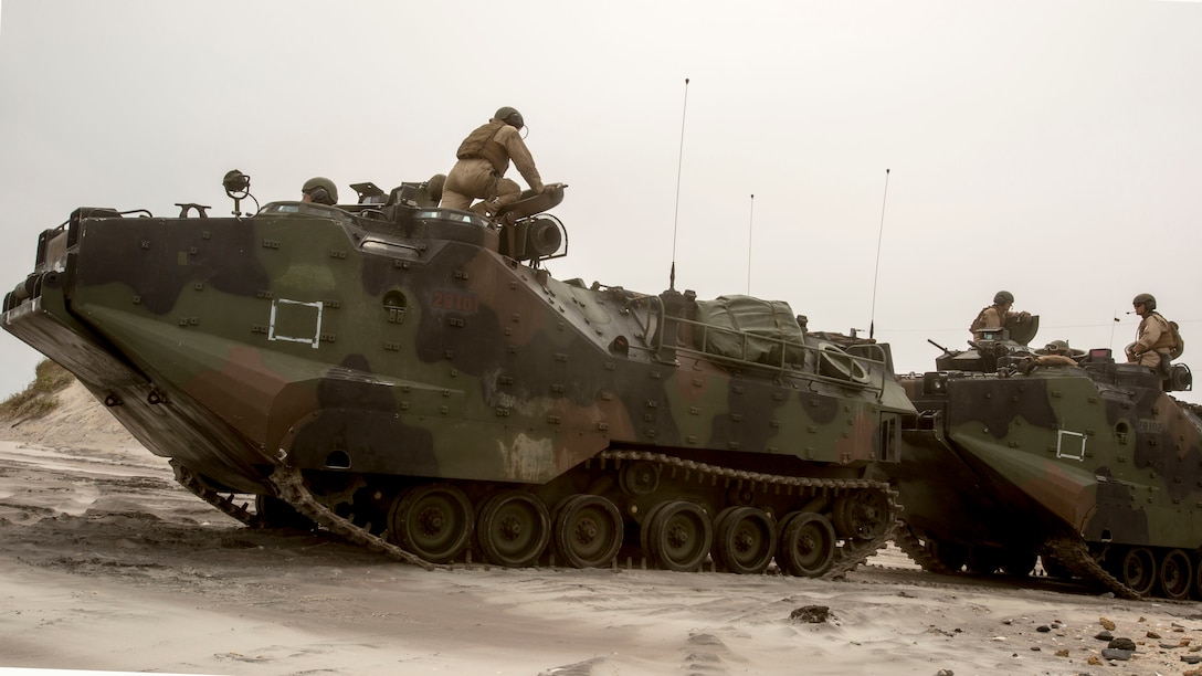 Marines prepare to conduct amphibious operations during a training exercise at Camp Lejeune, N.C., June 2, 2017. The training enabled the Marines to become more proficient at beach landings through a series of drills in which they simulated coming off ship, driving to the coast and clearing an objective. The Marines are with 2nd Amphibious Assault Battalion.