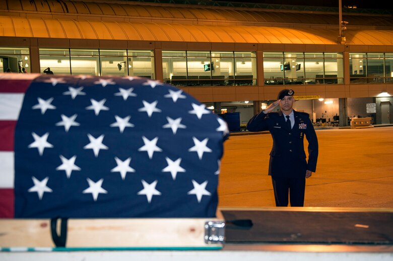 Lt. Col. José Antonio Lebrón, Joint Task Force-Bravo joint security forces commander, Soto Cano Air Base, Honduras, salutes his nephew’s, Senior Airman Gabriel Antonio Fuentes Lebrón, 18th Security Forces Squadron, Kadena Air Base, Japan, casket during a dignified arrival in Jacksonville, Fla., May 30, 2017. A dignified arrival is the process by which, upon the return from the theater of operations to the United States, the remains of fallen military members are transferred from an aircraft to a waiting vehicle and then to the port mortuary. Lebrón passed away in Okinawa, May 19. (U.S. Air Force photo by Senior Airman Greg Nash)