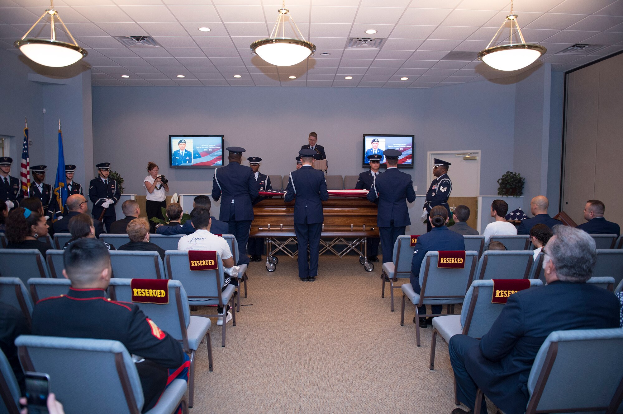 Family, friends and comrades mourn during a funeral for deceased Senior Airman Gabriel Antonio Fuentes Lebrón, 18th Security Forces Squadron, Kadena Air Base, Japan, in Orange Park, Fla., June 1, 2017. Lebrón’s most recent accomplishment was being selected for promotion to Senior Airman Below The Zone, March 23, and was posthumously promoted on the day of his passing, May 19. He leaves behind his parents, older brother, Miguel Angel, sisters Michelle and Valerie, niece, Ileana, as well as countless other family members and friends. (U.S. Air Force photo by Senior Airman Greg Nash)