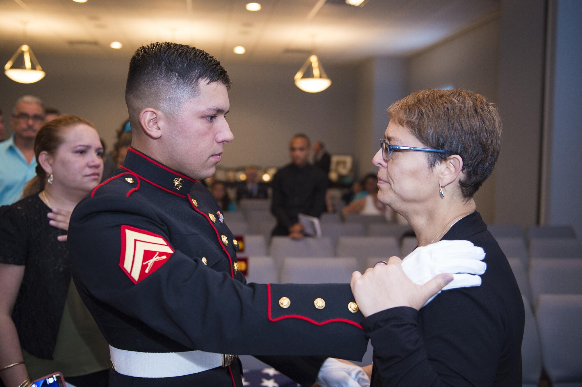 U.S. Marine Corporal Juan Martinez, Marine Barracks, Washington, D.C., consoles Maribel Lebrón, mother of deceased U.S. Air Force Senior Airman Gabriel Antonio Fuentes Lebrón, 18th Security Forces Squadron, Kadena Air Base, Japan, during a funeral in Orange Park, Fla., June 1, 2017. Martinez and Lebrón were childhood friends and were stationed together in Okinawa at Kadena Air Base. (U.S. Air Force photo by Senior Airman Greg Nash)