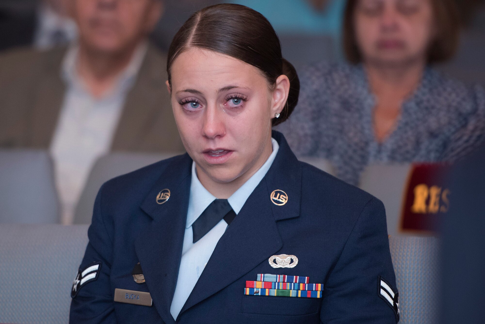 Airman 1st Class Cassandra Bucka, 18th Security Forces Squadron, Kadena Air Base, Japan, mourns her deceased comrade, Senior Airman Gabriel Antonio Fuentes Lebrón, 18th SFS, during a funeral in Orange Park, Fla., June 1, 2017. Lebrón’s most recent accomplishment was being selected for promotion to Senior Airman Below The Zone, March 23, and was posthumously promoted on the day of his passing, May 19. He leaves behind his parents, older brother, Miguel Angel, sisters Michelle and Valerie, niece, Ileana, as well as countless family members and friends. (U.S. Air Force photo by Senior Airman Greg Nash)