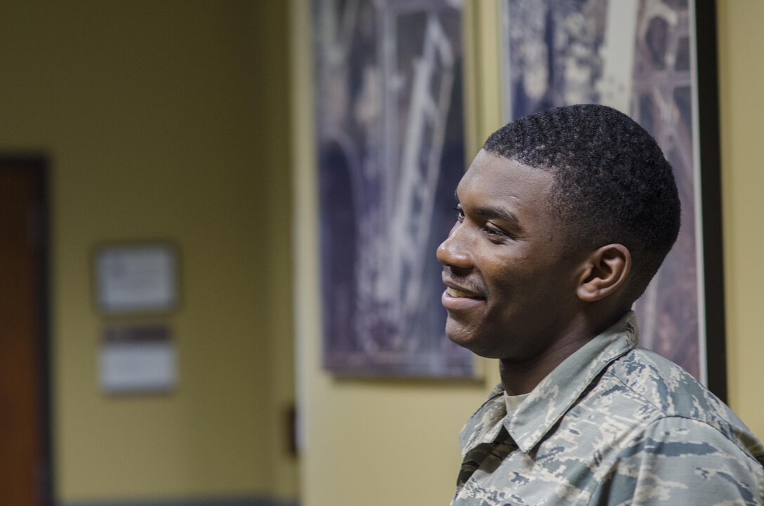 Airman First Class Thojae Peoples, 108th Civil Engineering Squadron, heating ventilation air conditioning specialist, speaks with the operations manager about the days inspections at the CES headquarters located on Joint Base McGuire-Dix-Lakehurst, New Jersey, April 19, 2017. (U.S. Air National Guard photo by Staff Sgt. Ross A. Whitley/Released)