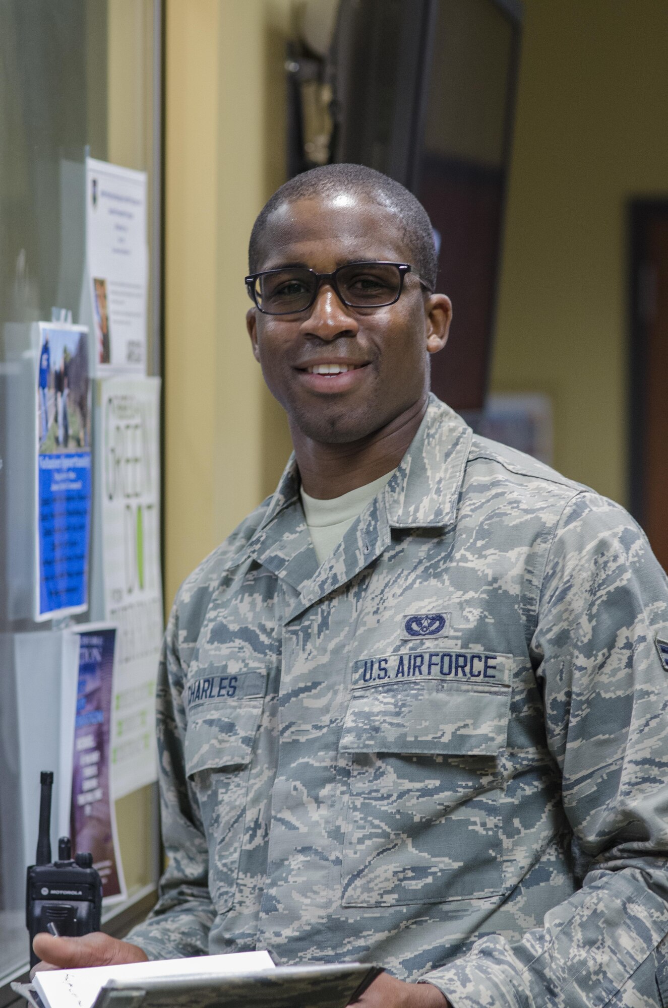 Airman 1st Class Marchelle Charles, 108th Civil Engineering Squadron Structures Shop, looks at the camera after speaking with the operations manager about the days inspections at the 108th Civil Engineering Squadron Headquarters Joint Base McGuire-Dix-Lakehurst, New Jersey, April 19, 2017. (U.S. Air National Guard photo by Staff Sgt. Ross A. Whitley/Released)