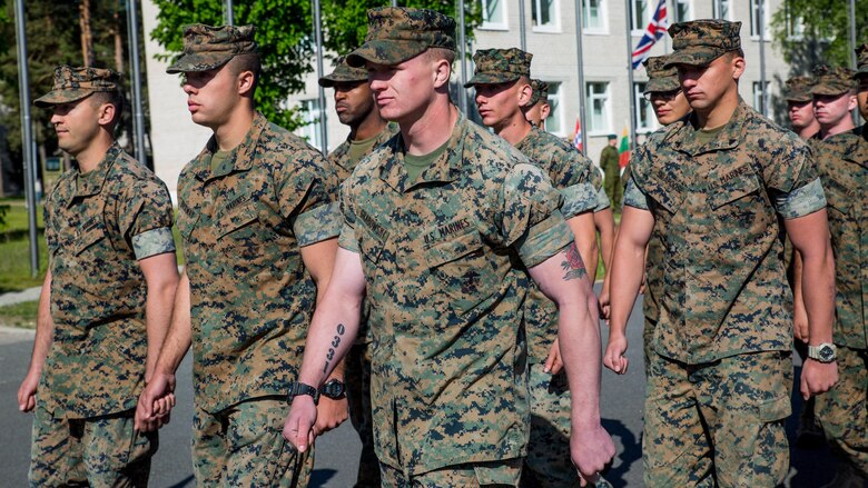 Marines with the Black Sea Rotational Force 17.1 march in formation in preparation for the opening ceremony of Exercise Saber Strike 17 at Camp Adazi, Latvia, June 3, 2017.  The combined training prepares NATO Allies and partners to respond faster to regional crises and meet their own security needs by improving the security of borders and countering threats.