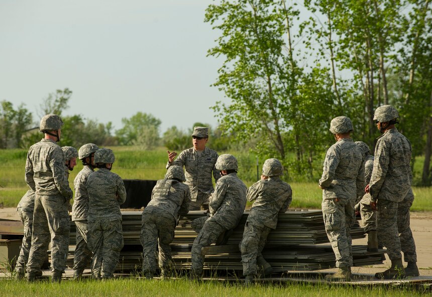 Airmen from the 5th Civil Engineer Squadron learn about convoy operations during an Expeditionary Training Day at Minot Air Force Base, N.D., June 1, 2017. More than 60 Airmen from the 5th CES participated in the training, to prepare them for future combat deployments. (U.S. Air Force photo/Senior Airman Apryl Hall)