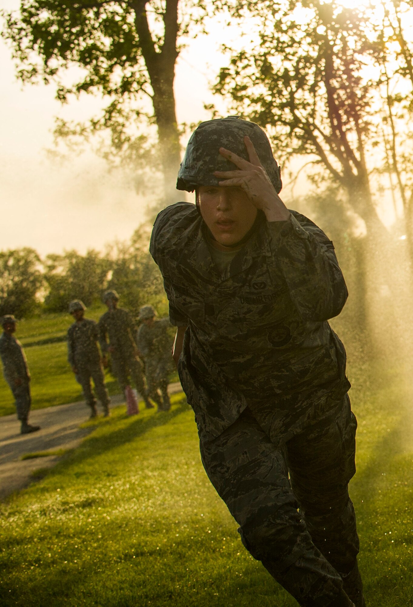 Airman 1st Class Bailey Rowley, 5th Civil Engineer firefighter, recovers after a tactical maneuver during an Expeditionary Training Day at Minot Air Force Base, N.D., June 1, 2017. Throughout the day, CE Airmen participated in mock deployment operations to include a ruck march, site set-up, search-and-rescue tactics, rappelling and convoy operations. (U.S. Air Force photo/Senior Airman Apryl Hall)