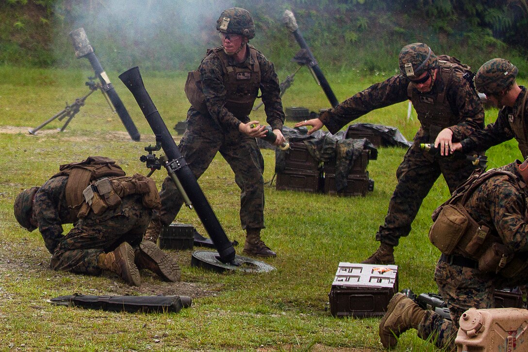 A Marine Corps mortar team prepares to fire an 81 mm mortar during training at Camp Hansen, Okinawa, Japan, May 31, 2017. The Marines are assigned to Weapons Company, Battalion Landing Team, 3rd Battalion, 5th Marines. Marine Corps photo by Staff Sgt. T. T. Parish