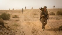 U.S. Marines patrol during a live-fire raid training event, part of Mission Rehearsal Exercise, in southern Jordan Sept. 12, 2016. The MRX is a collective training event where the Marine Air Ground Task Force elements collaborate to refine individual and cooperative capabilities. Marine Corps Systems Command, the acquisition command of the Marine Corps, is realigning its organizational structure to more rapidly equip the MAGTF with information technology and ground weapon systems and equipment. (U.S. Marine Corps photo by Cpl. Trever Statz/Released)