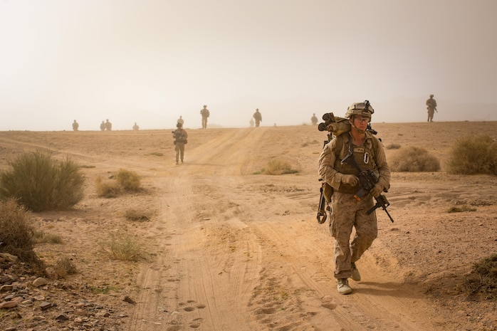 U.S. Marines patrol during a live-fire raid training event, part of Mission Rehearsal Exercise, in southern Jordan Sept. 12, 2016. The MRX is a collective training event where the Marine Air Ground Task Force elements collaborate to refine individual and cooperative capabilities. Marine Corps Systems Command, the acquisition command of the Marine Corps, is realigning its organizational structure to more rapidly equip the MAGTF with information technology and ground weapon systems and equipment. (U.S. Marine Corps photo by Cpl. Trever Statz/Released) - High Resolution Photo