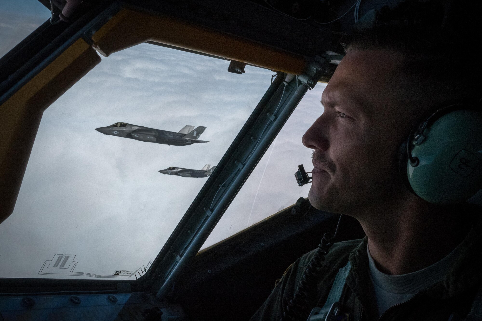 Capt. Matt Davis, 909th Air Refueling Squadron KC-135 Stratotanker pilot, flies in formation with U.S. Marine Corps F-35B Lightning IIs from Marine Fighter Attack Squadron 121, March 14, 2017, over the Pacific Ocean. The training sortie marked the first air refueling mission with F-35s in the 909th ARS’s area of operation. (U.S. Air Force photo by Senior Airman John Linzmeier)