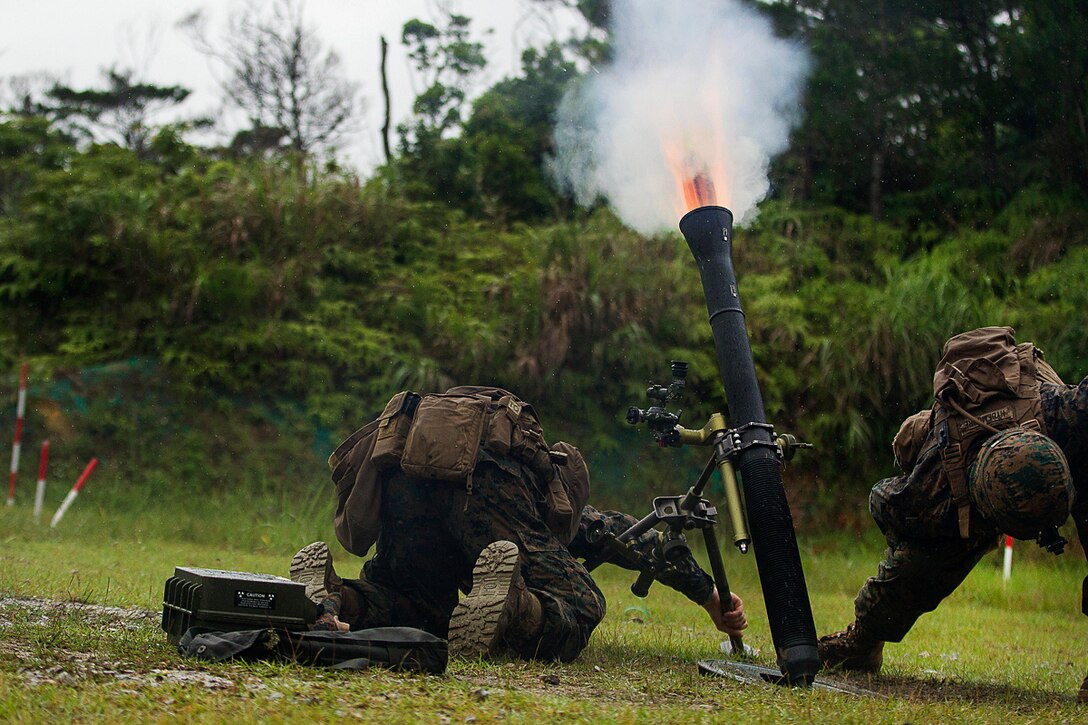 A Marine Corps mortar team fires an 81 mm mortar during training at Camp Hansen, Okinawa, Japan, May 31, 2017. Marine Corps photo by Staff Sgt. T. T. Parish