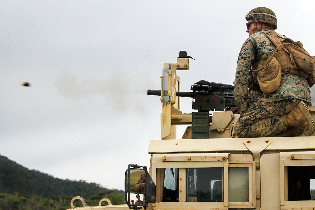 Marines fire a Mark 19 automatic grenade launcher from the turret of a Humvee at Camp Schwab, Okinawa, Japan, June 1, 2017. The Marines are assigned to Weapons Company, Battalion Landing Team, 3rd Battalion, 5th Marines. The Mark 19 is designed to suppress and destroy enemy threats, and fires 40 mm high-explosive grenades at up to 375 rounds a minute. Marine Corps photo by Staff Sgt. T. T. Parish