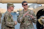 U.S. Central Command Commanding General, Army Gen. Joseph L. Votel (right) discusses maintenance and modernization of Army Prepositioned Stocks-5 heavy equipment with Col. Aaron Stanek, commander, 401st Army Field Support Brigade during a tour of the facility at Camp Arifjan, Kuwait, June 3. (U.S. Army photo by Justin Graff, 401st AFSB Public Affairs) (Photo Credit: Mr. Justin Graff (Rock Island Arsenal))