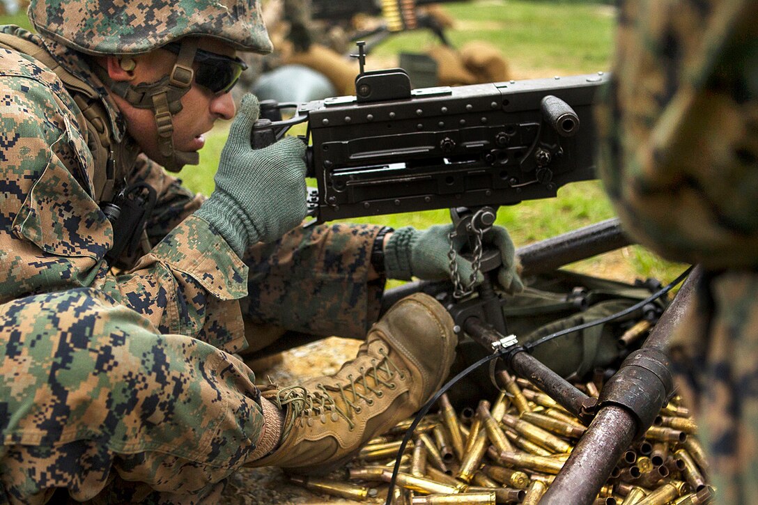 Marine Corps Cpl. Cristobal A. Pacheco sights-in with an M2 .50-caliber Browning machine gun during training at Camp Schwab, Okinawa, Japan, June 1, 2017. Pacheco is an assault amphibious vehicle commander assigned to the 31st Marine Expeditionary Unit. Marine Corps photo by Staff Sgt. T. T. Parish