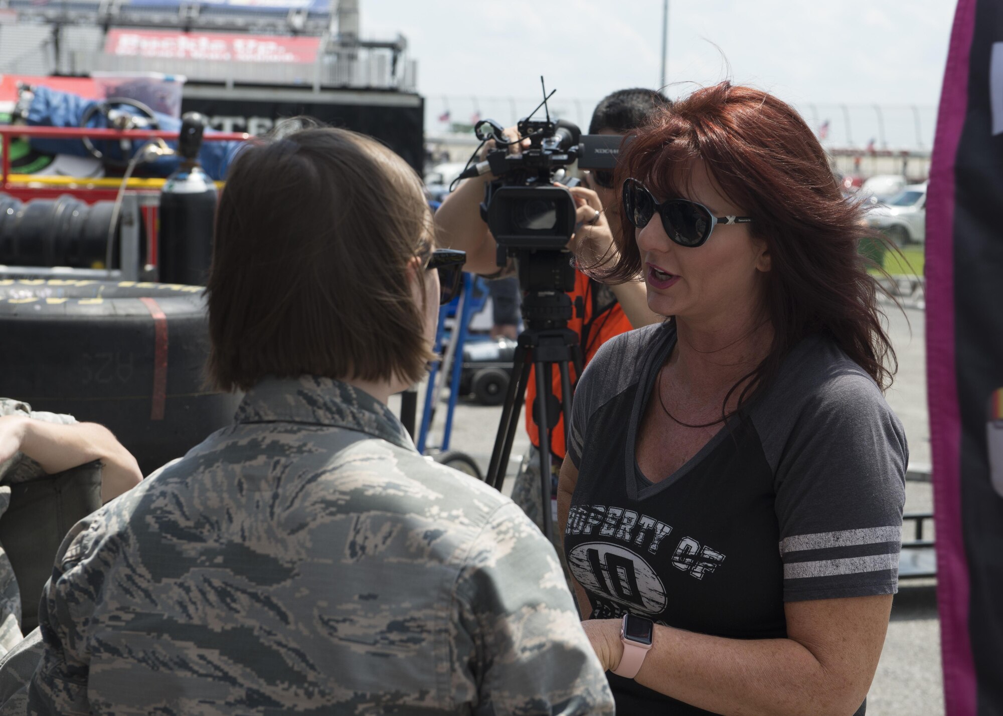Jennifer Jo Cobb, NASCAR Camping World Truck Series #10 Driven2Honor Chevrolet driver, speaks with Team Dover Airmen prior to the start of the Bar Harbor 200 June 2, 2017, at Dover International Speedway, Del. Driven2Honor’s goal is to inspire the nation’s youth that the military is a viable option for education and financial support to reach their dreams. (U.S. Air Force photo by Senior Airman Zachary Cacicia)