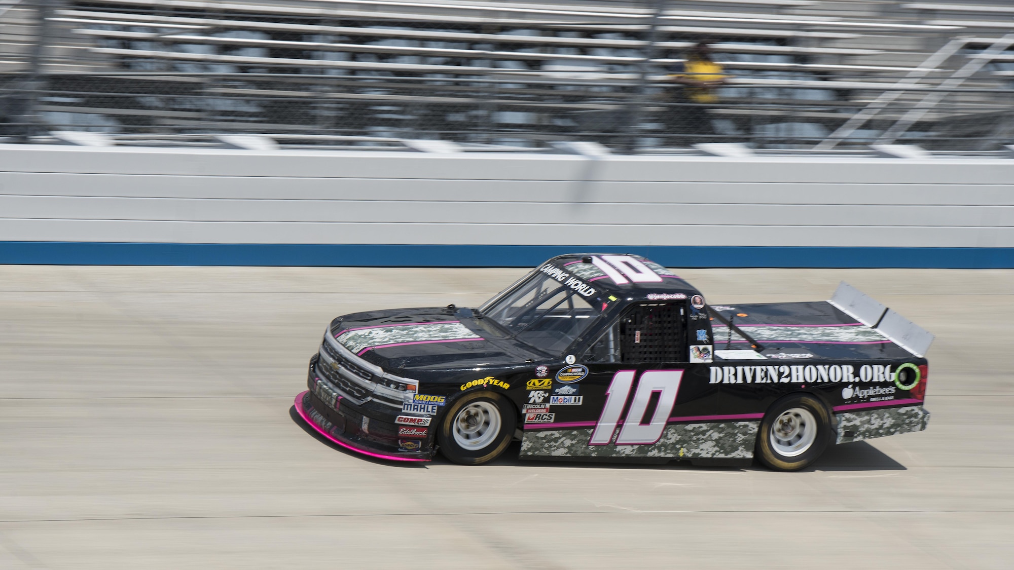 The NASCAR Camping World Truck Series #10 Driven2Honor Chevrolet, driven by Jennifer Jo Cobb, races around the Monster Mile during qualifying laps prior to the start of the Bar Harbor 200 June 2, 2017, at Dover International Speedway, Del. Driven2Honor honors hundreds of military members at NASCAR races across the country with VIP experiences. (U.S. Air Force photo by Senior Airman Zachary Cacicia)