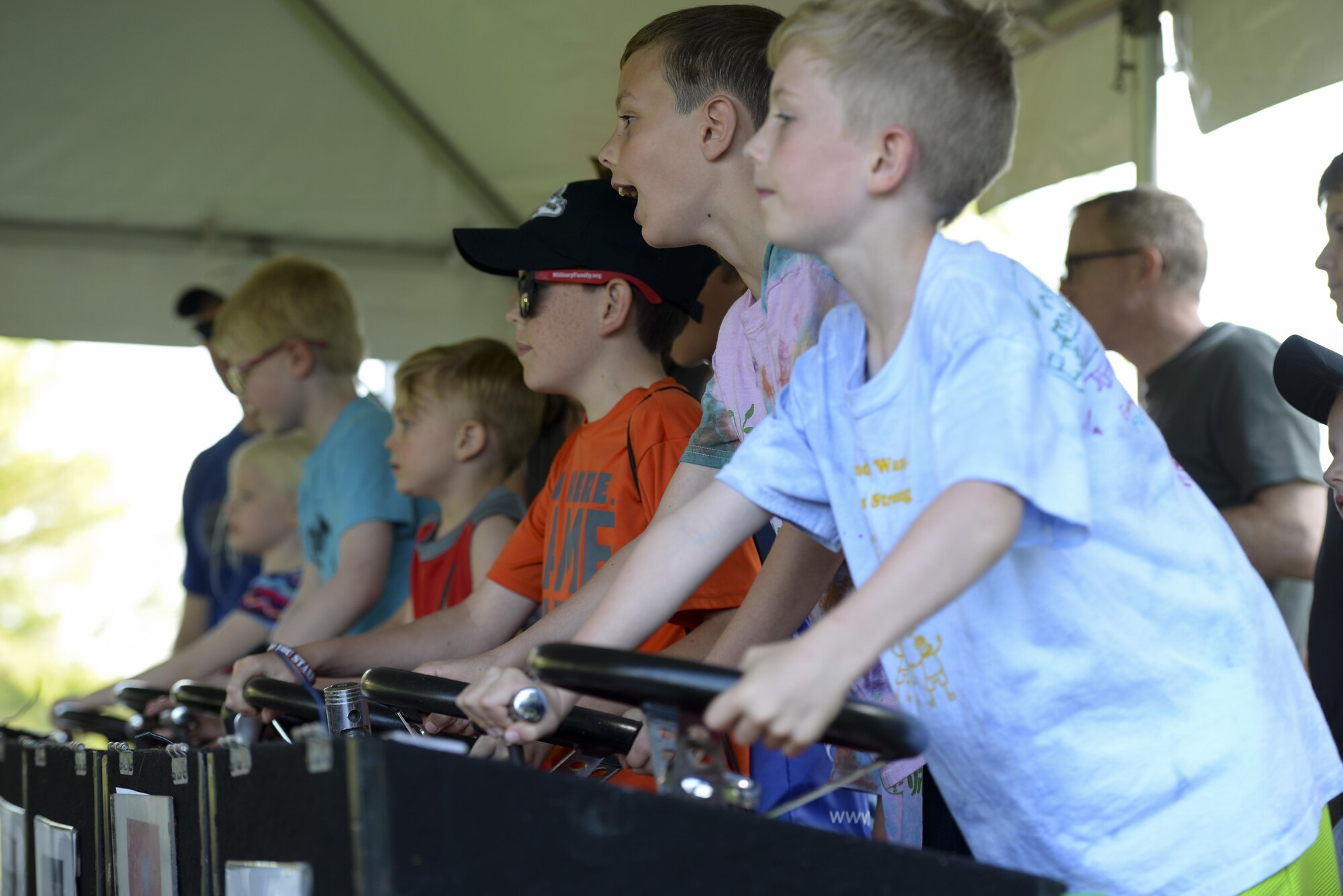 Members of Team Dover race remote controlled cars during the biannual NASCAR Social June 2, 2017, at Dover Air Force Base, Del. The family-friendly event featured events for all age groups. (U.S. Air Force photo by Senior Airman Aaron J. Jenne)