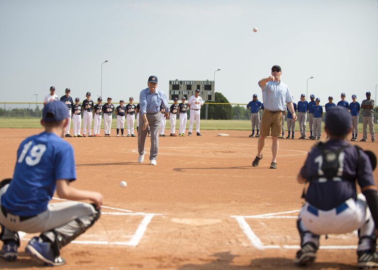 Brig. Gen. Lance Landrum, 31st Fighter Wing commander, and Mario Rispoli, founder and honorary president of the Junior Alpina league, throw the ceremonial first pitches June 3, 2017, at Aviano Air Base, Italy. Rispoli is one of the first Italians who played baseball when Army Brig. Gen. Edmund Sebree, a U.S. Army forces commander during World War II, introduced the game to locals in 1945. (U.S. Air Force photo by Senior Airman Cory W. Bush)