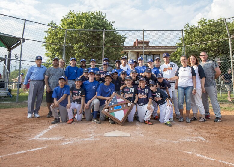 Players from the Aviano Tigerz and Junior Alpina baseball teams gather for a group photo June 3, 2017, at Aviano Air Base, Italy. In this goodwill game, winning or losing did not matter, it was about making new and long-lasting relationships.  (U.S. Air Force photo by Senior Airman Cory W. Bush)