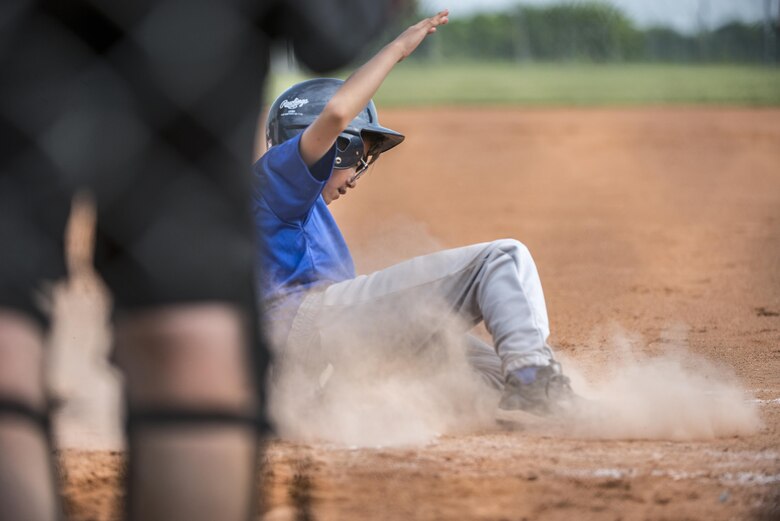An Aviano Tigerz player scores a run during a baseball game June 3, 2017, at Aviano Air Base, Italy. The Aviano Tigerz hosted the Junior Alpina team from Trieste, Italy, in a friendly match that fostered competition as well as friendship. (U.S. Air Force photo by Senior Airman Cory W. Bush)