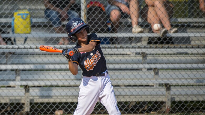 A player from the Junior Alpina baseball team swings during a baseball game June 3, 2017, at Aviano Air Base, Italy. Over the past 172 years, the game has expanded beyond the United States of America and is played from field to field in over 50 different countries. (U.S. Air Force photo by Senior Airman Cory W. Bush)