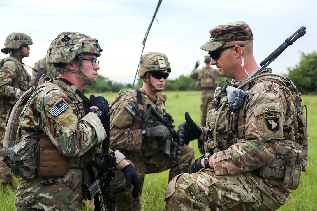 Soldiers discuss a mission plan before participating in a live-fire event during Exercise United Accord 2017 at Bundase Training Camp in Bundase, Ghana, May 27, 2017. The soldiers are assigned to the 101st Airborne Infantry Division’s 1st Battalion, 506th Infantry Regiment, 1st Brigade Combat Team. Army photo by Pfc. Joseph Friend 