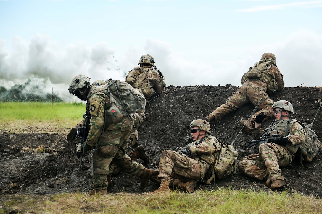 Soldiers take cover during a live-fire training event as part of exercise United Accord 2017 at Bundase Training Camp in Bundase, Ghana, May 27, 2017. Army photo by Pfc. Joseph Friend