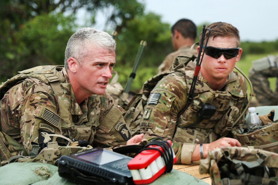 Army 1st Sgt. Ryan Jeffers, left, and Army Lt. Lane Lawson await orders while participating in Exercise United Accord 2017 at Bundase Training Camp in Bundase, Ghana, May 27, 2017. Jeffers and Lawson are assigned to the 101st Airborne Infantry Division’s 1st Battalion, 506th Infantry Regiment, 1st Brigade Combat Team. Army photo by Pfc. Joseph Friend