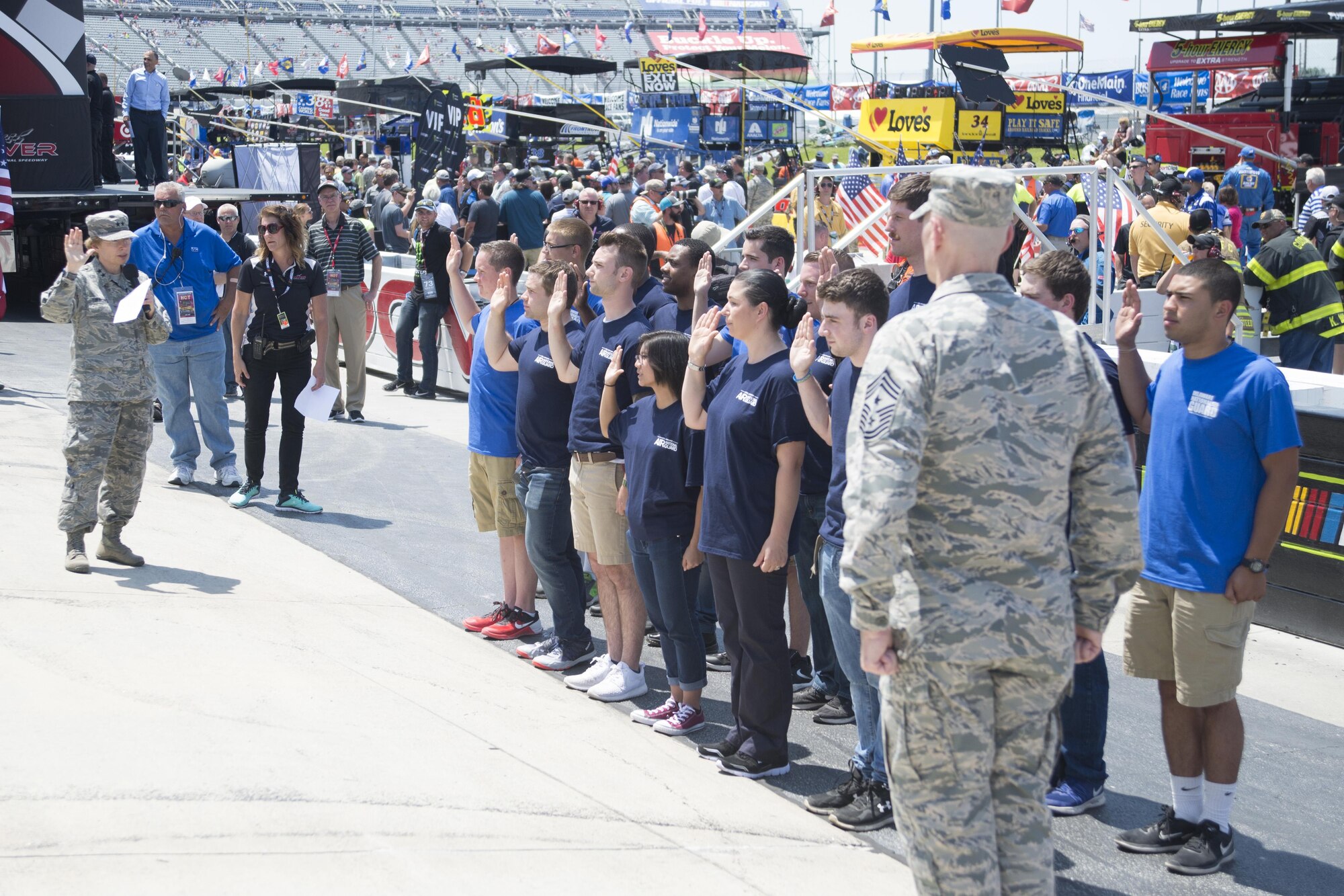 Maj. Gen.  Carol Timmons, Delaware National Guard Adjutant General, conducts the oath of enlistment before the start of the AAA 400 Drive for Autism Monster Energy race June 4, 2017, at Dover International Speedway, Dover, Del. Gen.  Timmons administered the oath to 15 enlistees who will be entering active duty or the National Guard.  (U.S. Air Force photo by Staff Sgt. Jared Duhon)